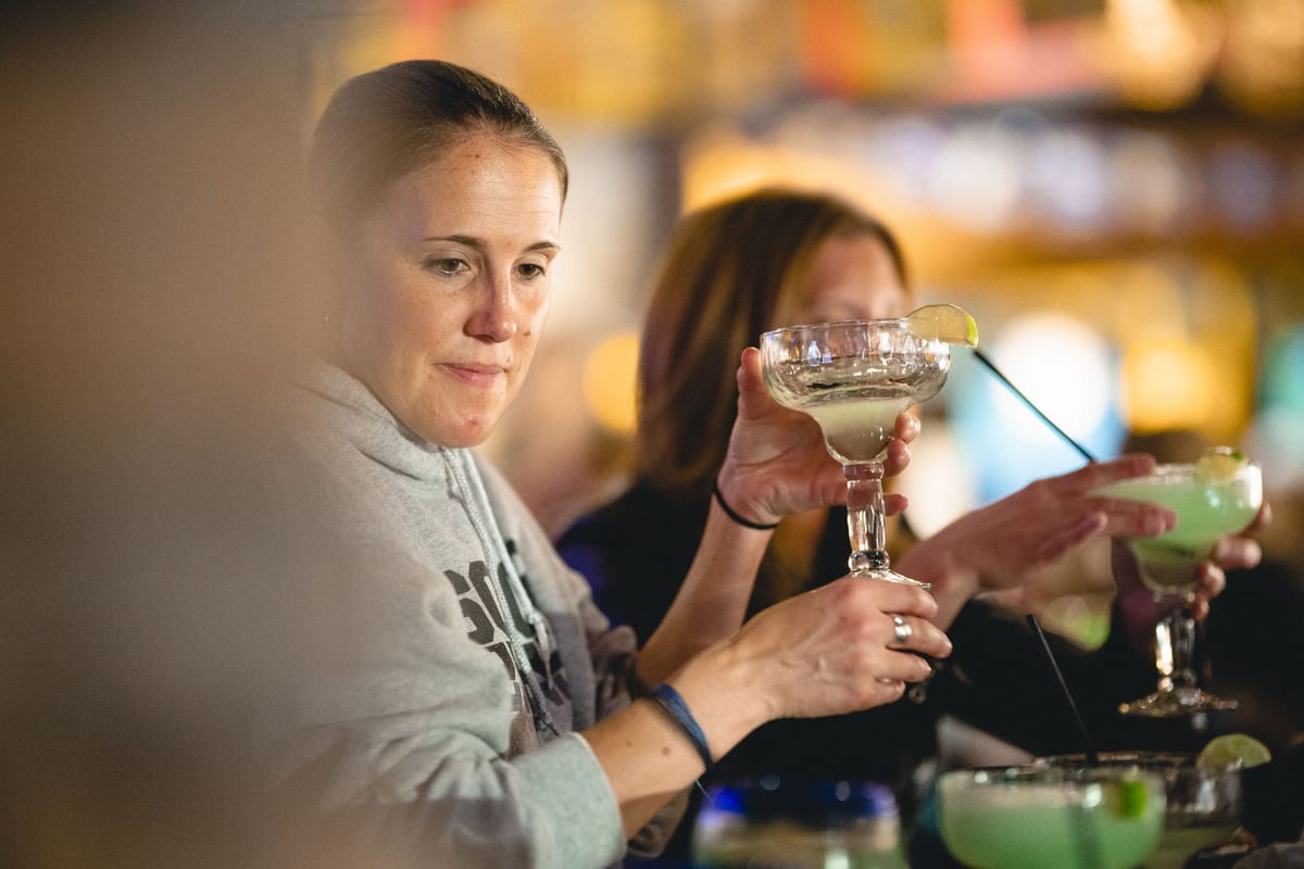 Guests raising margaritas at the La Tolteca bar